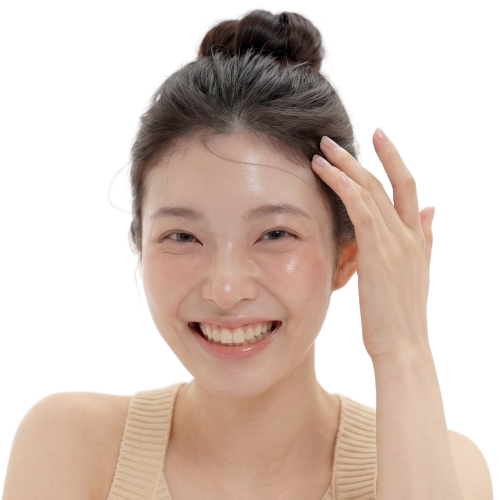 Smiling woman running her hand through her hair